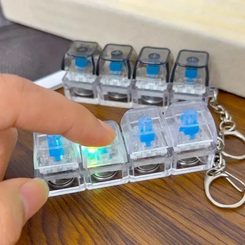 Nuevo llavero con teclado para aliviar el estrés y ansiedad, botones de cuatro dedos, ideal para la oficina, el hogar, adultos y niños.
